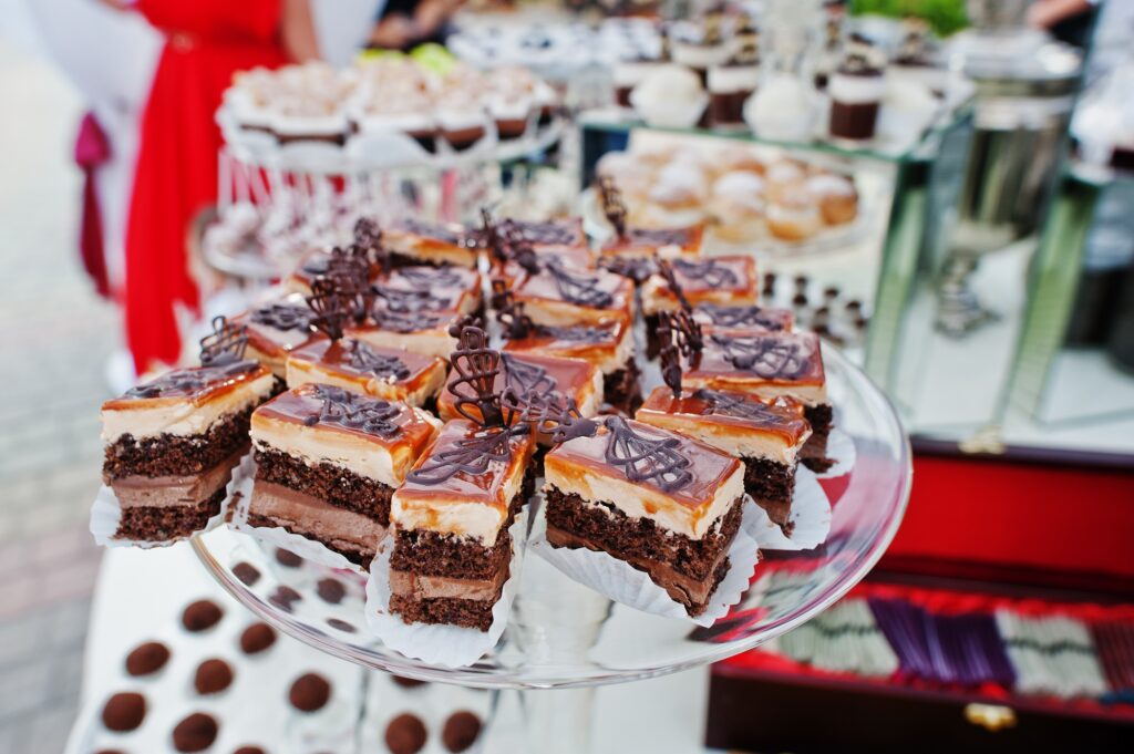 Wedding catering table with different sweets and cakes.